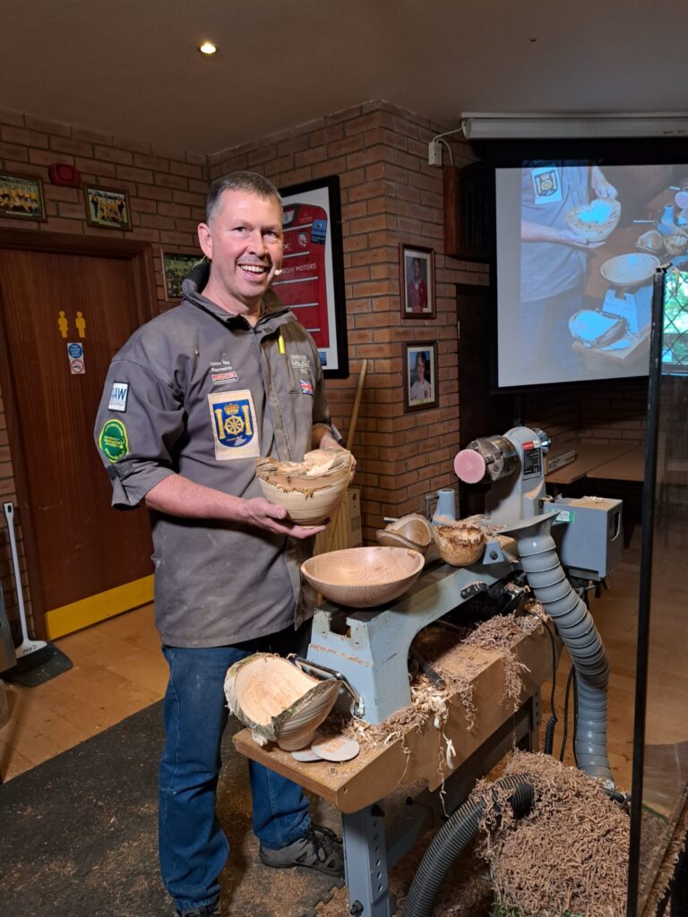 Colwin Way holding a wooden bowl
