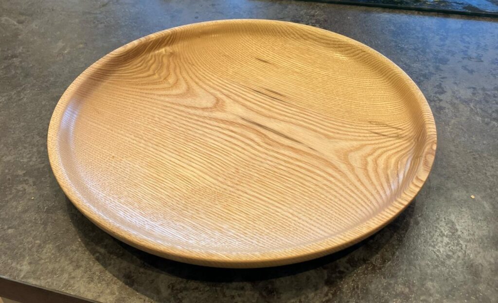 A shallow wooden platter made from Oak