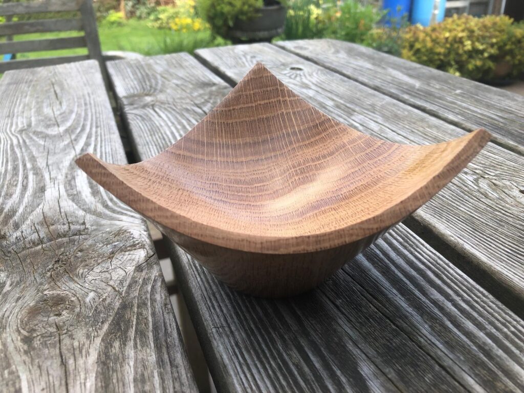A three cornered wooden bowl in Oak